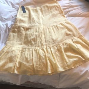 Mid-length pastel yellow theory skirt